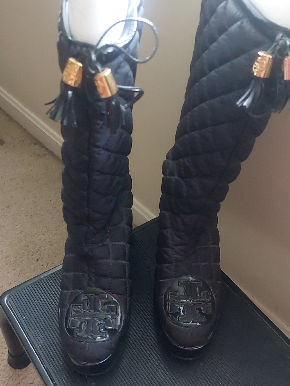 Tory Burch Black Quilted Knee-High Boots with Tassel and Logo Medallion